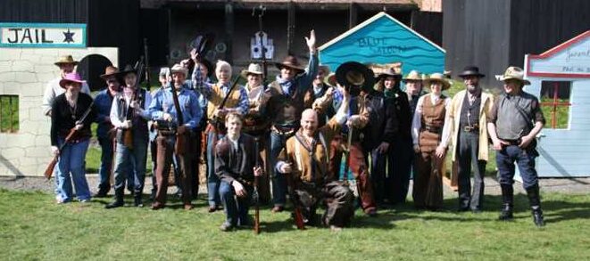 Members of North Cotes Butts in cowboy outfits at the western action shooting range